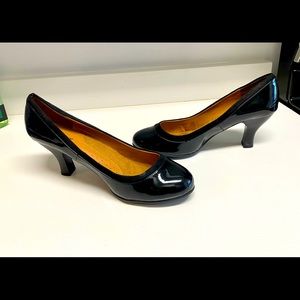 Shiny, black patent leather heels. Brand new. Never worn. Size 13ww.